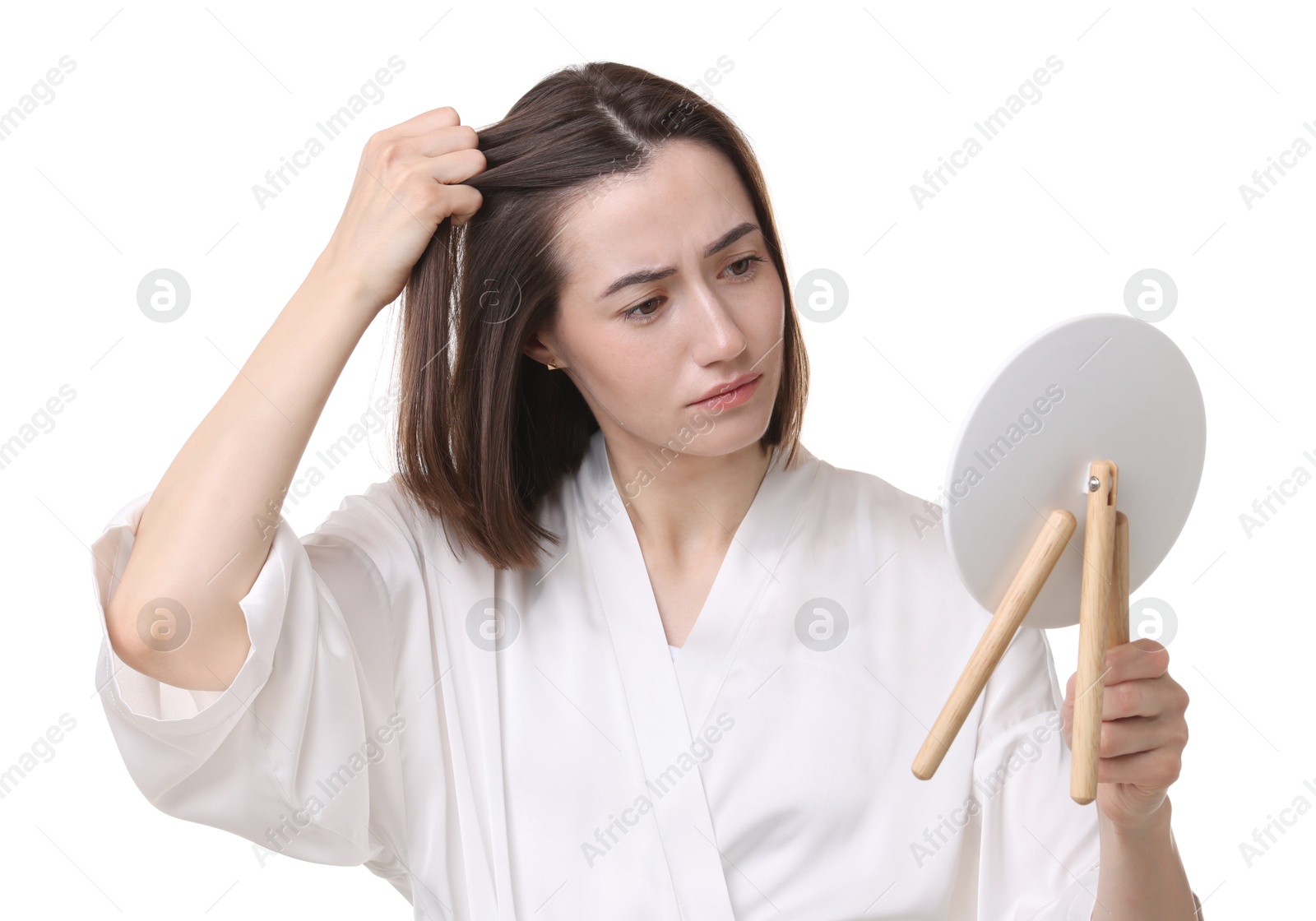 Photo of Sad woman with hair loss problem looking at mirror on white background