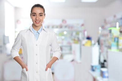 Positive pharmacist in uniform at drugstore. Space for text