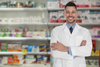 Image of Positive pharmacist in uniform at drugstore. Space for text