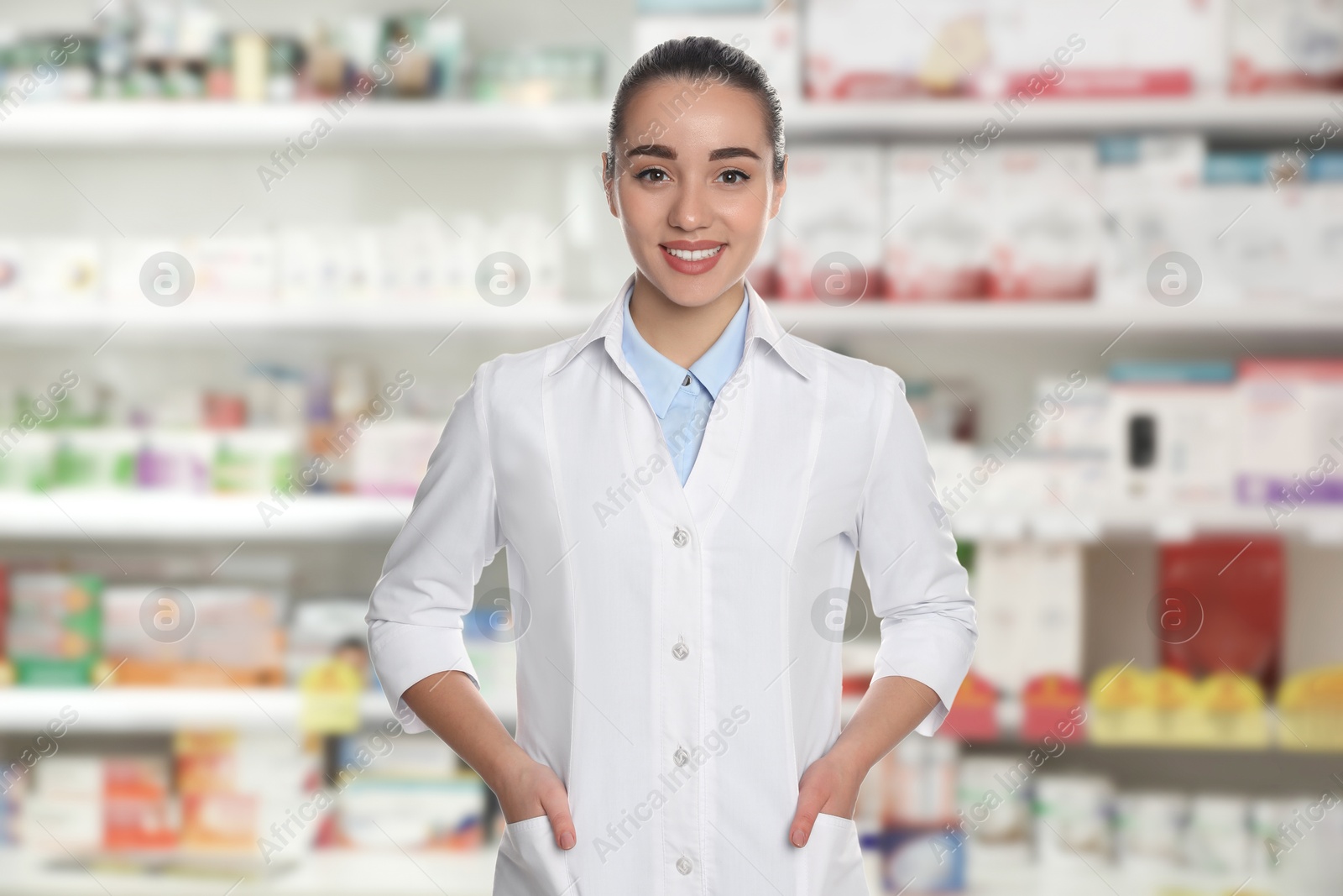 Image of Pharmacist in drugstore. Happy woman in uniform indoors