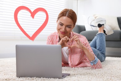 Long distance relationship. Young woman having video chat with her loved one indoors. Red heart near her