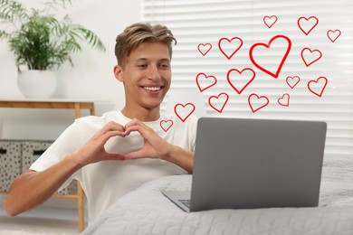 Long distance relationship. Young man having video chat with his loved one indoors. Red hearts near him