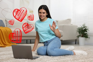 Long distance relationship. Young woman waving hello to her loved one via video chat indoors. Red hearts near her
