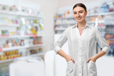 Image of Positive pharmacist in uniform at drugstore. Space for text