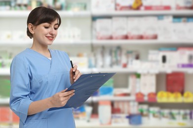 Image of Positive pharmacist in uniform at drugstore. Space for text