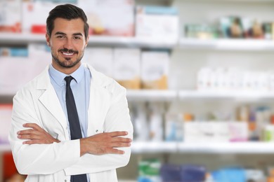 Positive pharmacist in uniform at drugstore. Space for text