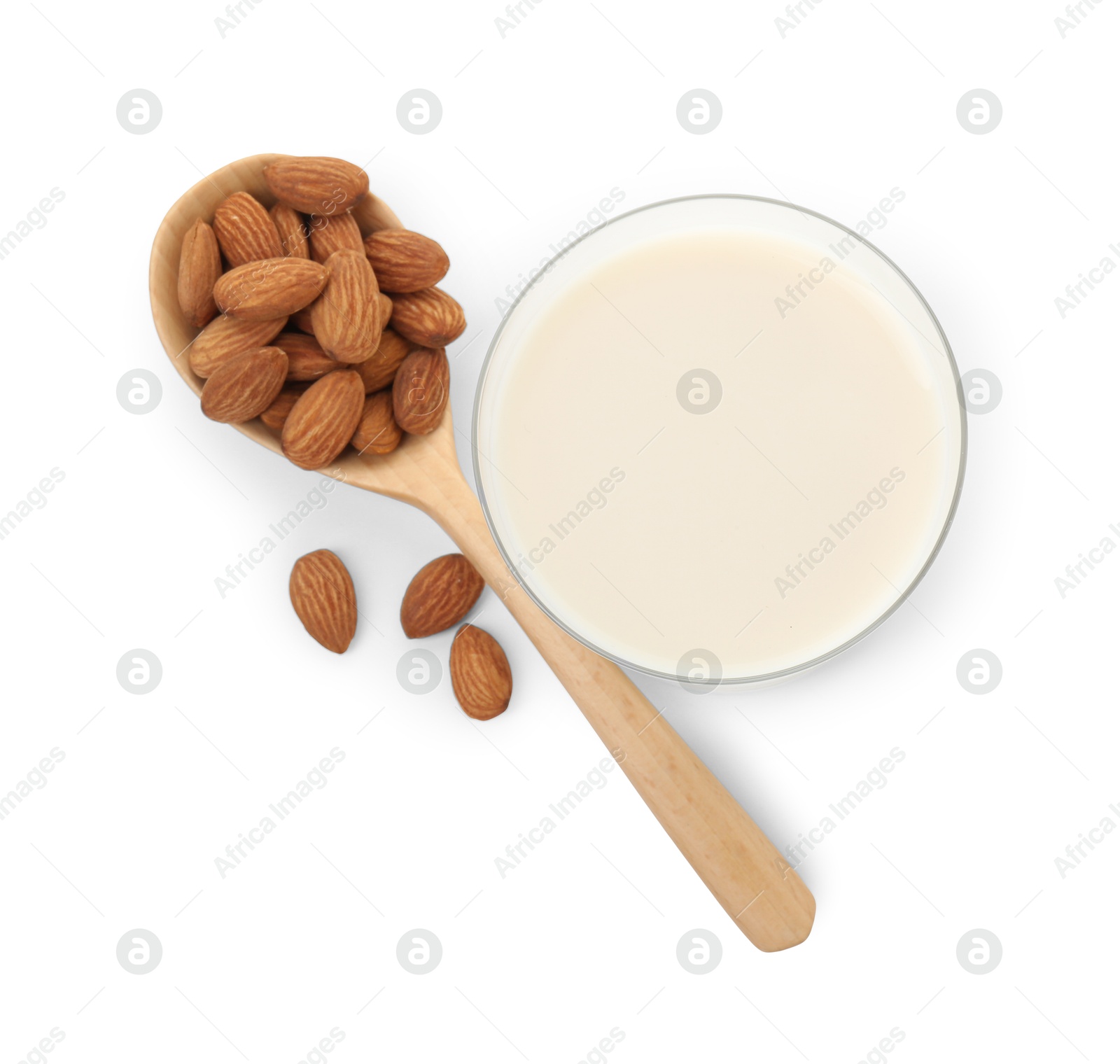 Photo of Glass of almond milk and almonds isolated on white, top view