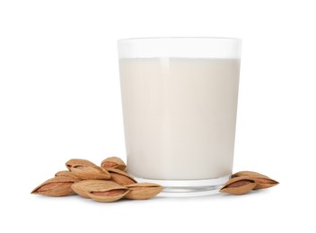 Photo of Glass of almond milk and almonds isolated on white