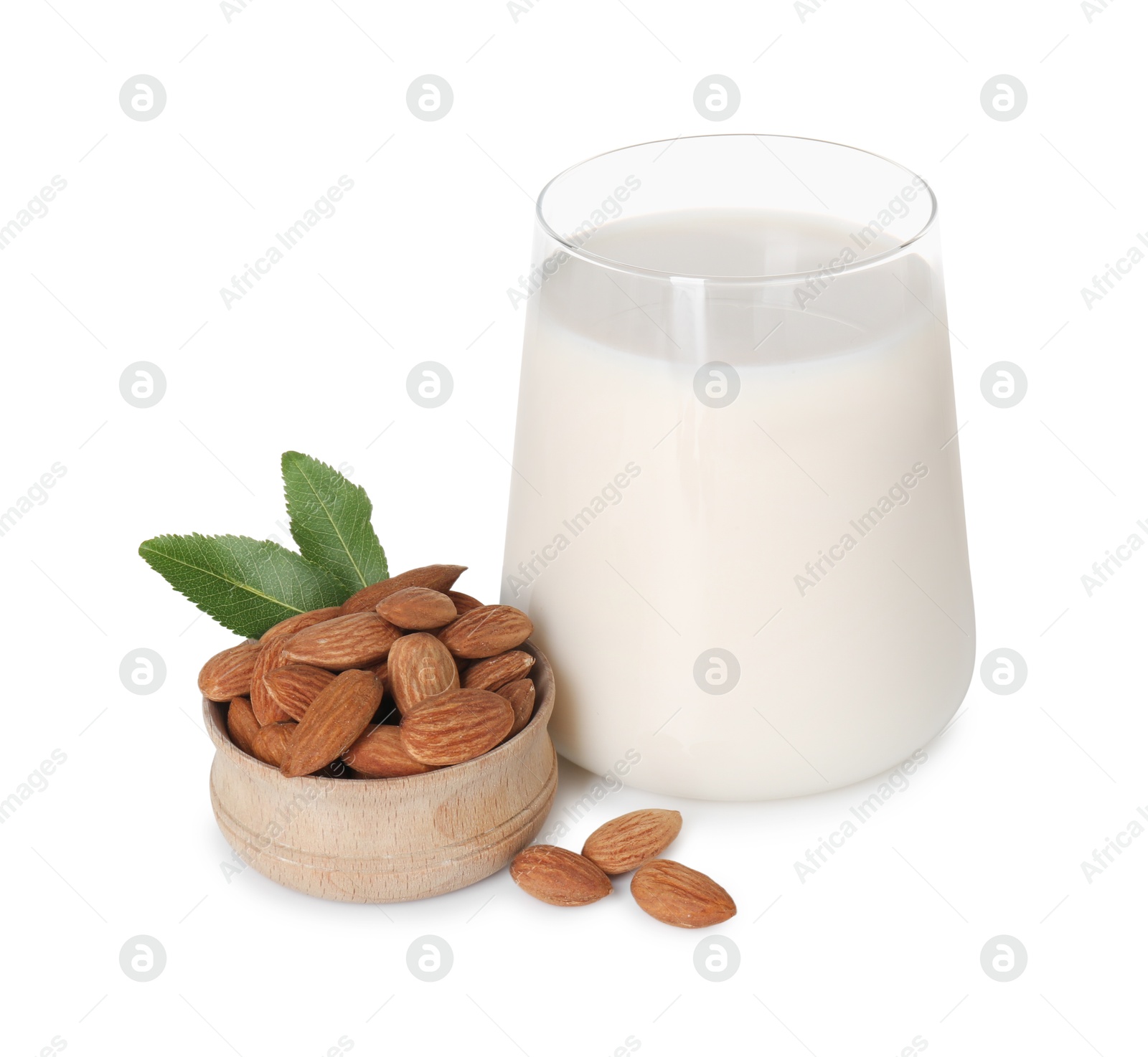 Photo of Glass of almond milk and almonds isolated on white