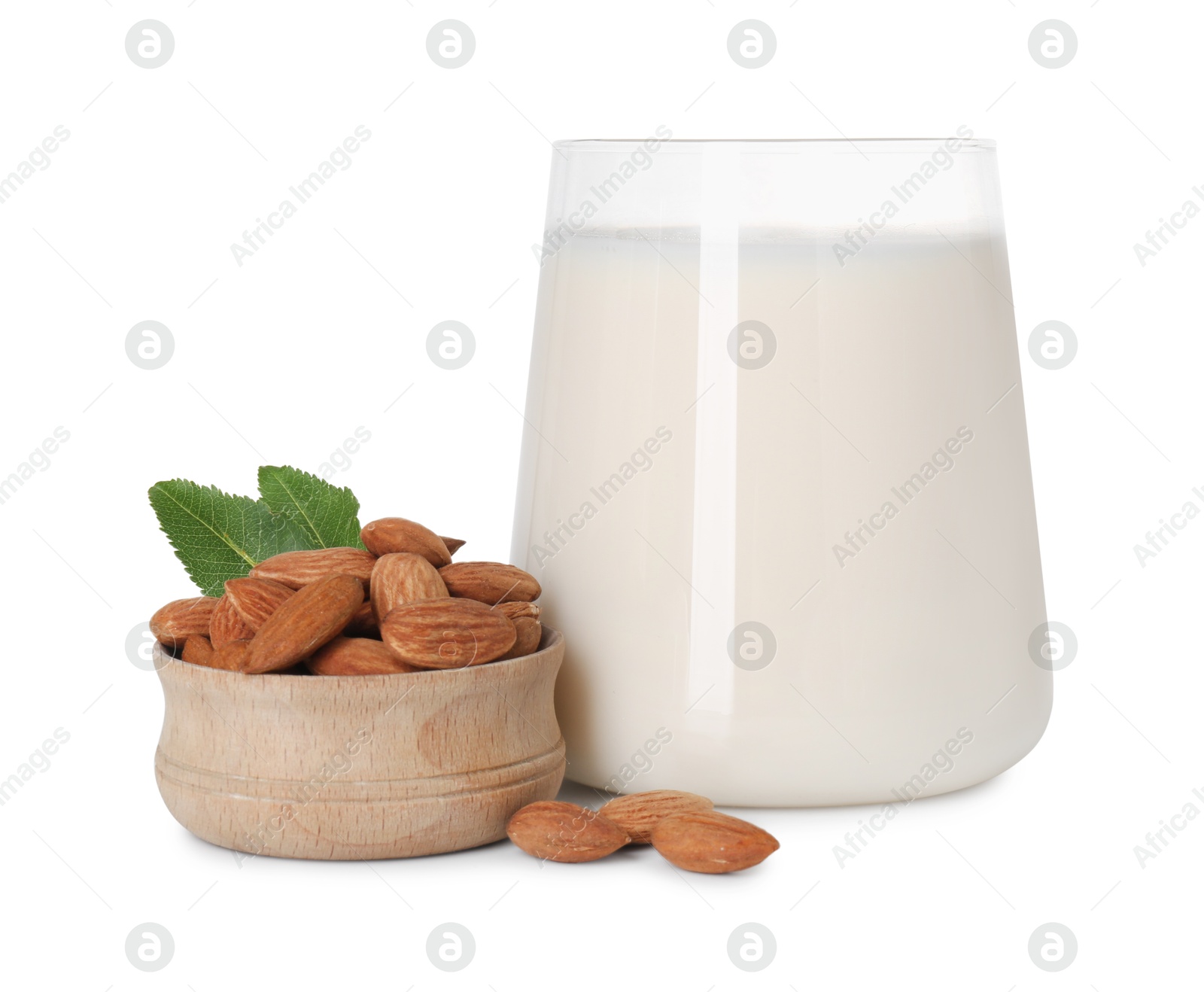 Photo of Glass of almond milk and almonds isolated on white