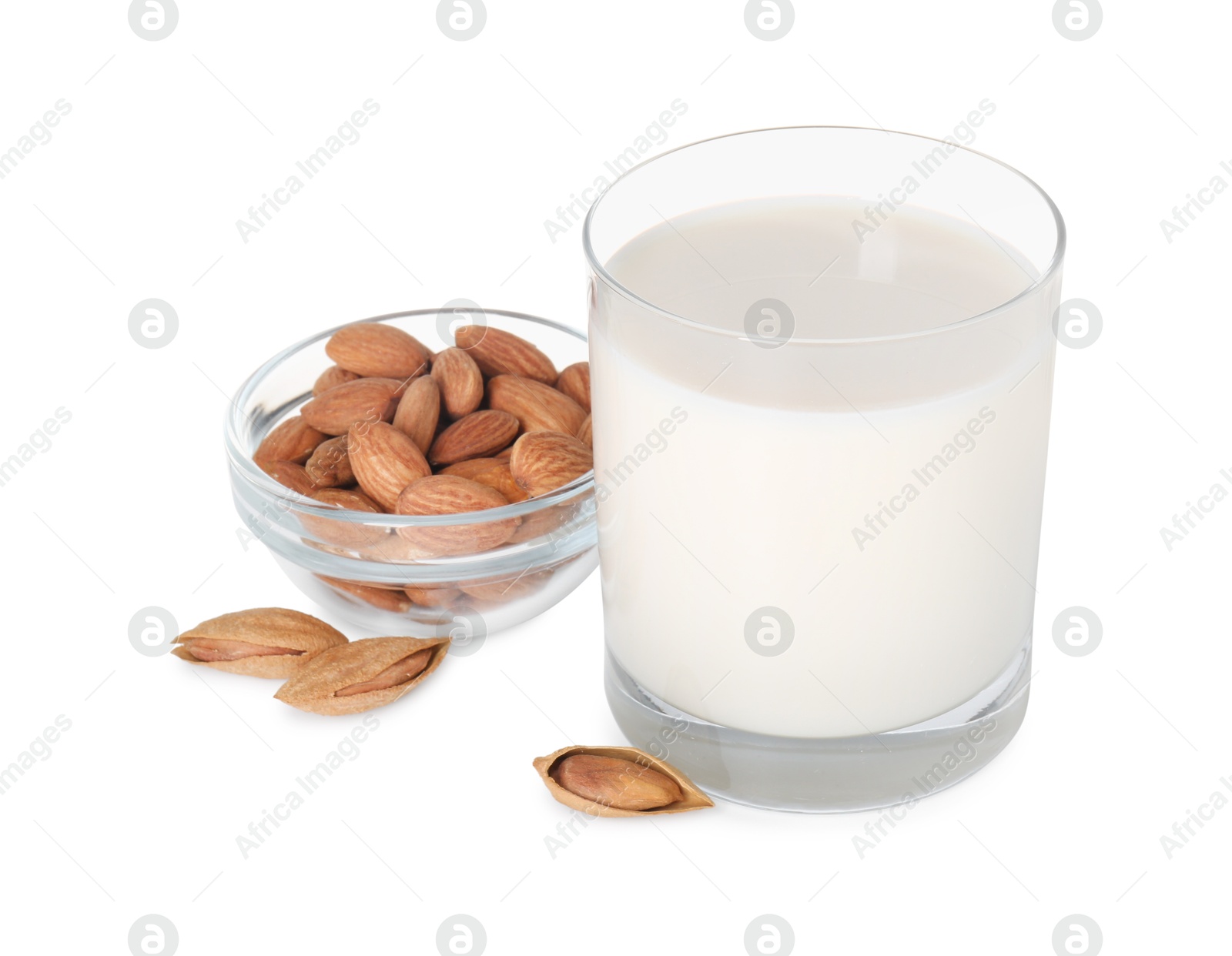 Photo of Glass of almond milk and almonds isolated on white