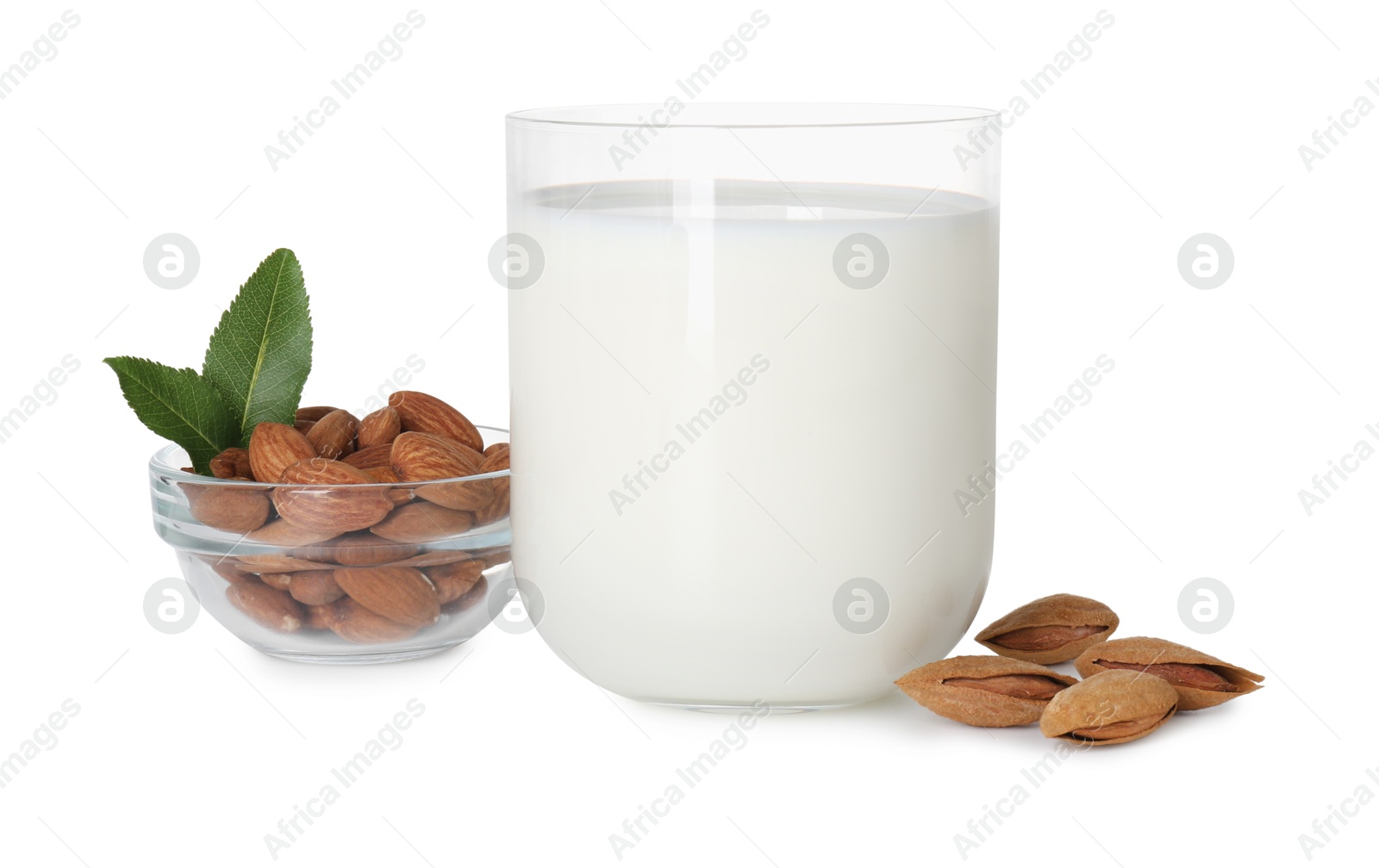 Photo of Glass of almond milk and almonds isolated on white