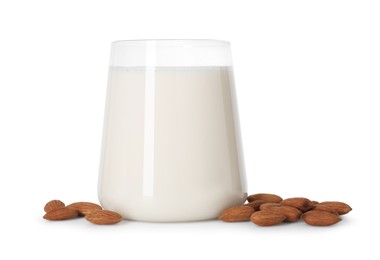 Glass of almond milk and almonds isolated on white