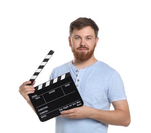 Making movie. Man with clapperboard on white background