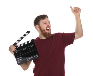 Making movie. Emotional man with clapperboard on white background
