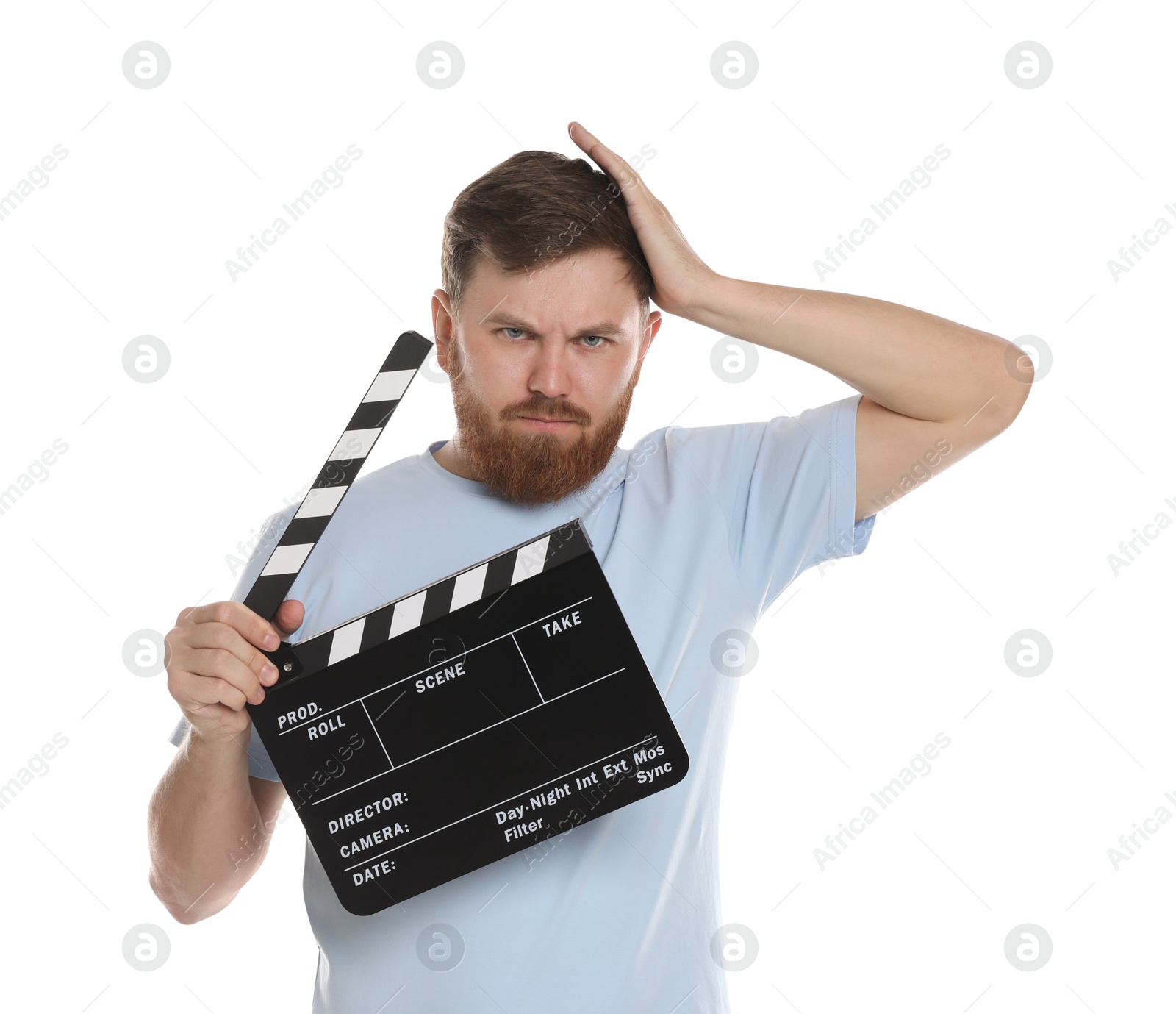 Photo of Making movie. Confused man with clapperboard on white background