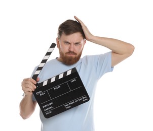 Making movie. Confused man with clapperboard on white background