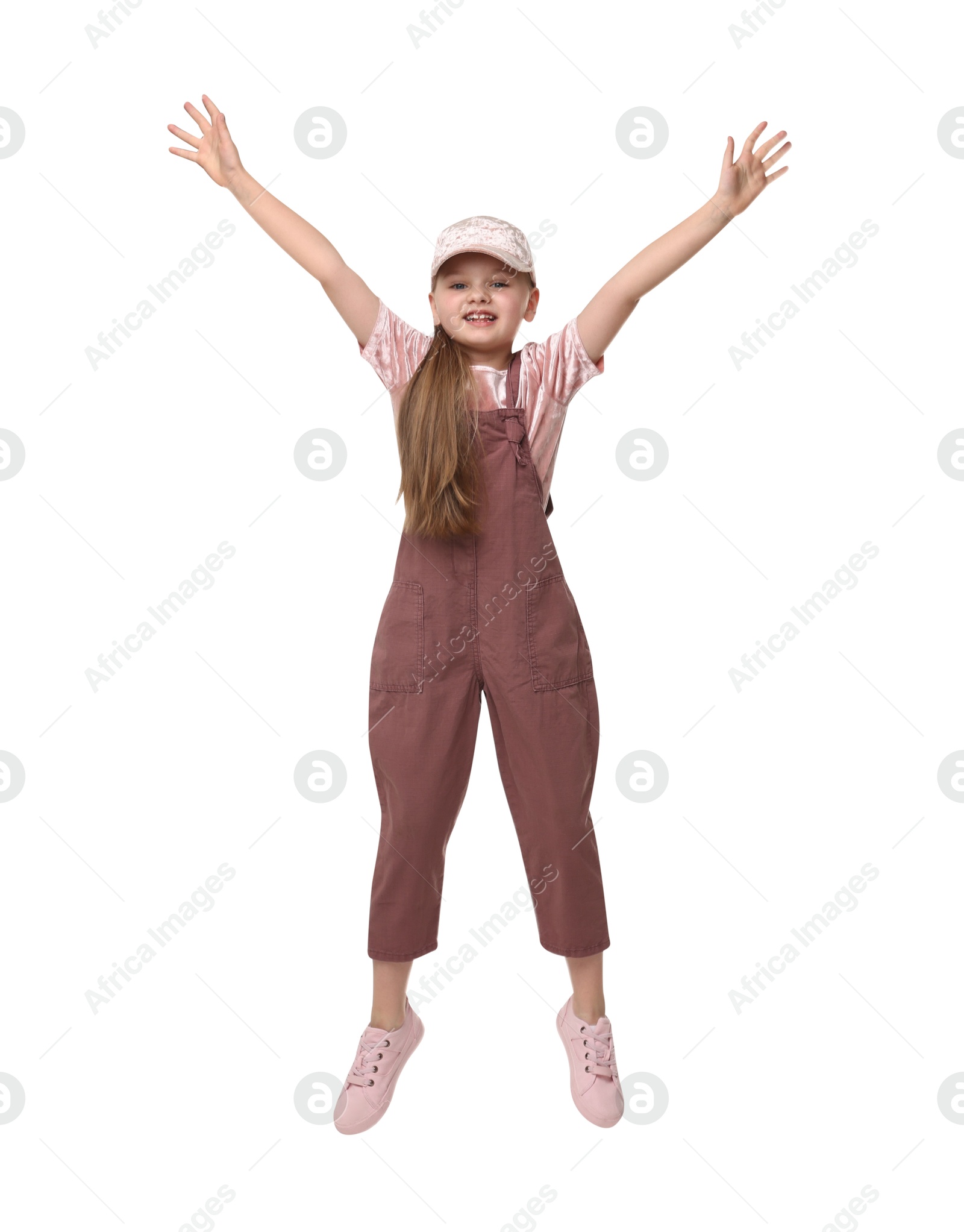 Photo of Cute little girl dancing on white background