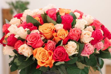 Photo of Bouquet of beautiful rose flowers on blurred background, closeup