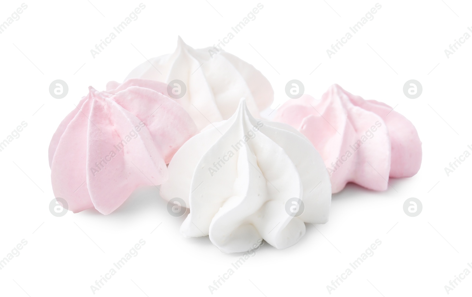 Photo of Many delicious meringue cookies isolated on white