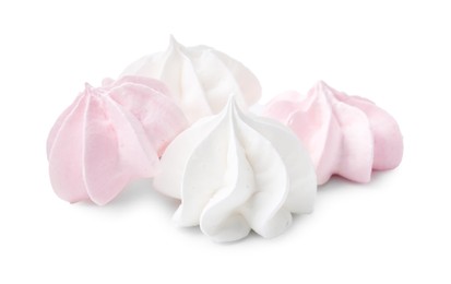 Photo of Many delicious meringue cookies isolated on white