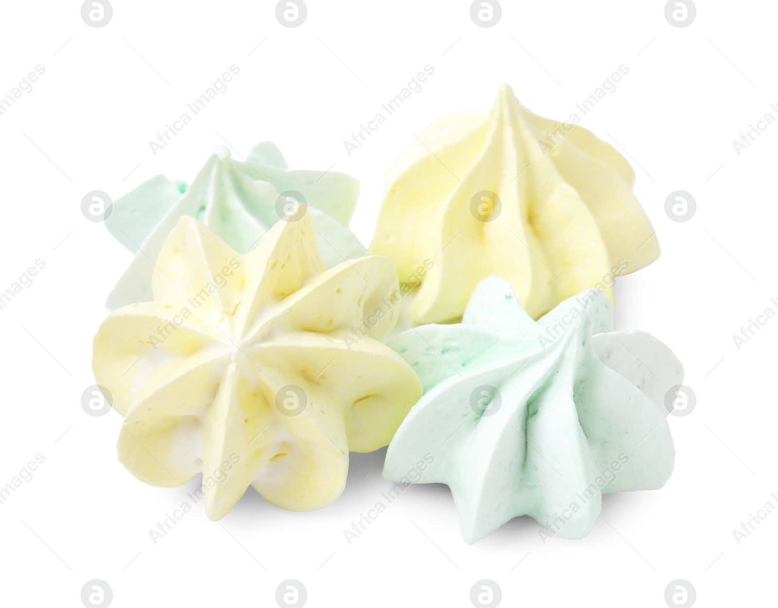 Photo of Many delicious meringue cookies isolated on white