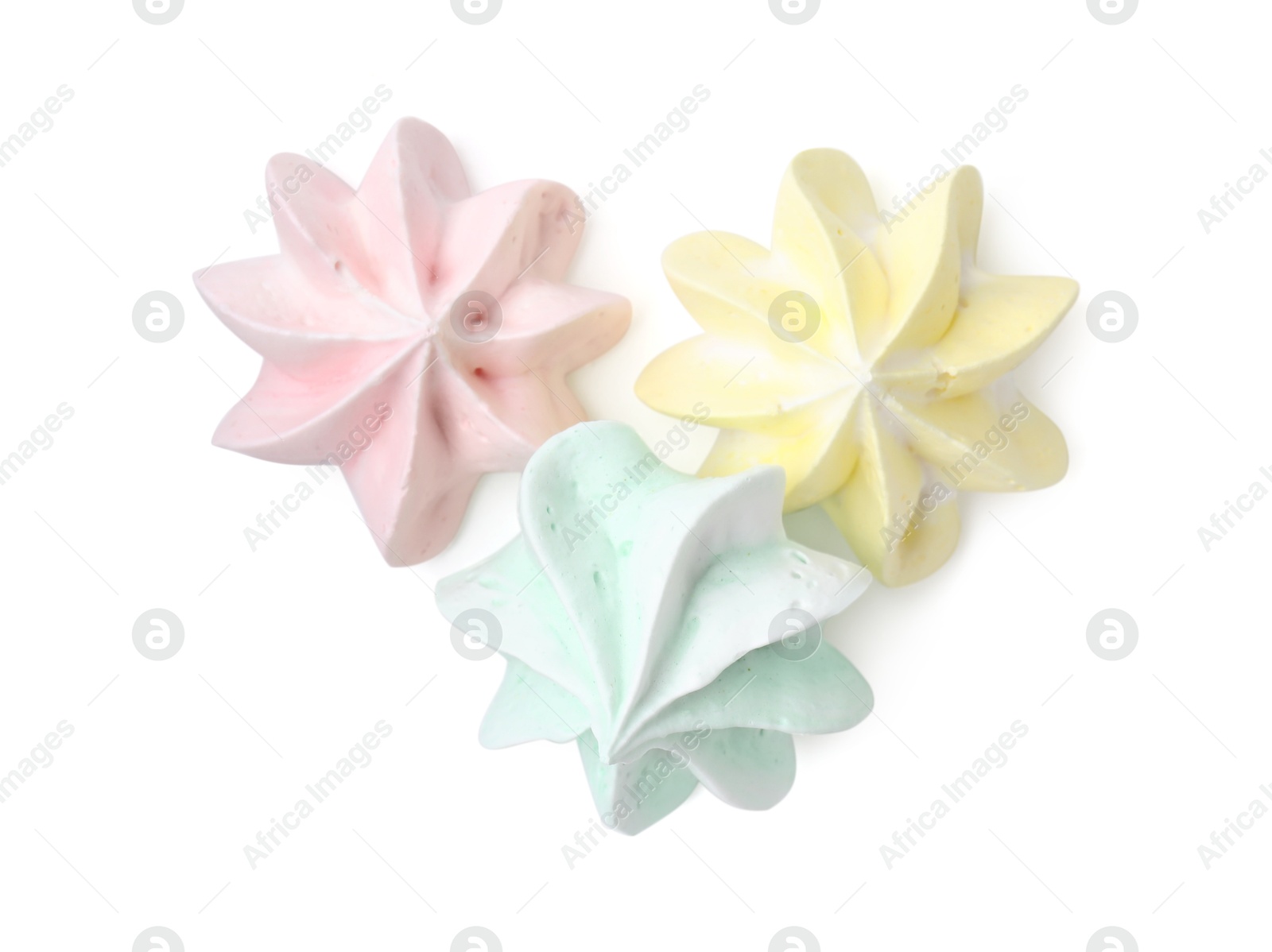 Photo of Three delicious meringue cookies isolated on white, top view