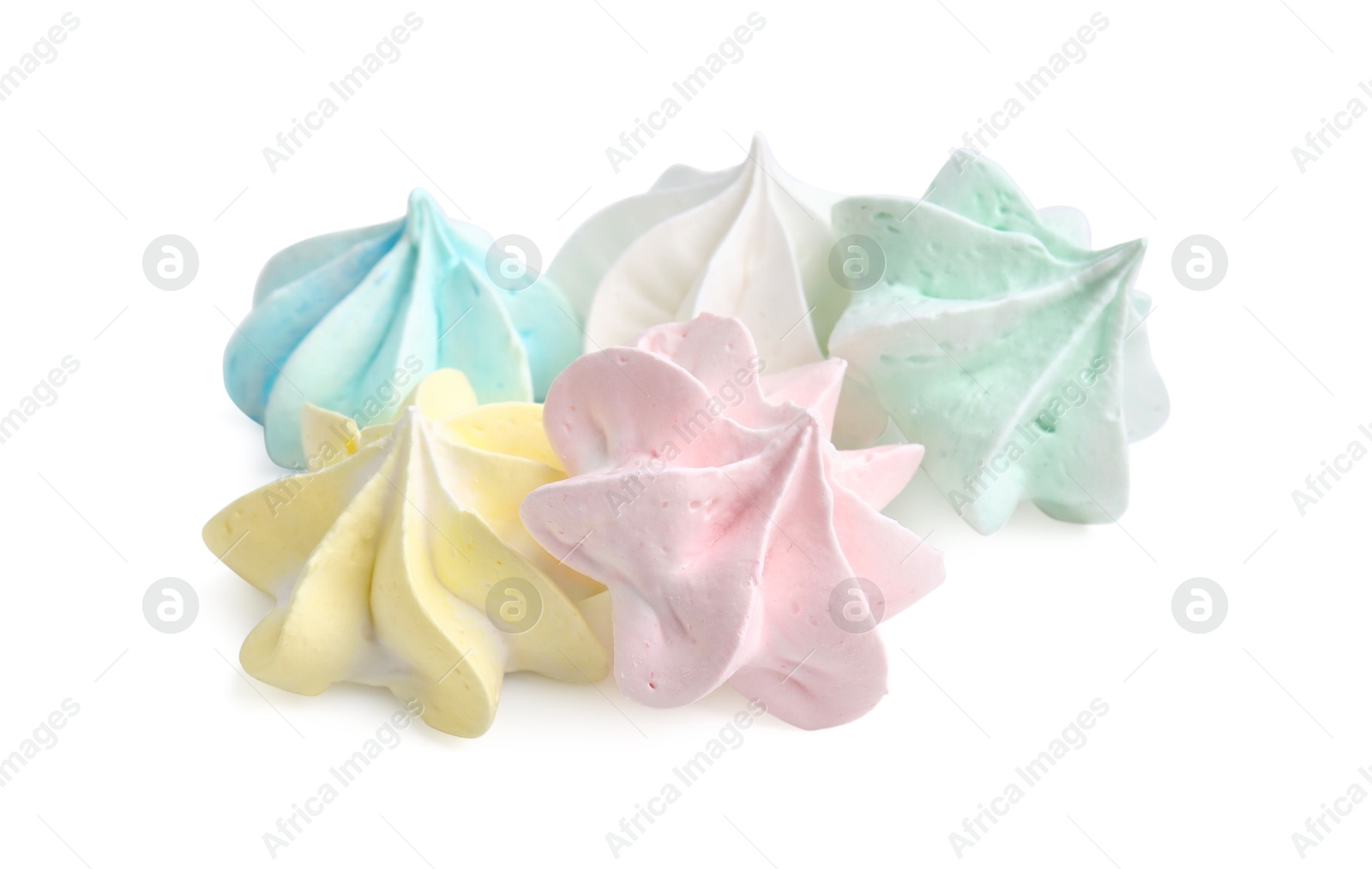 Photo of Many delicious meringue cookies isolated on white