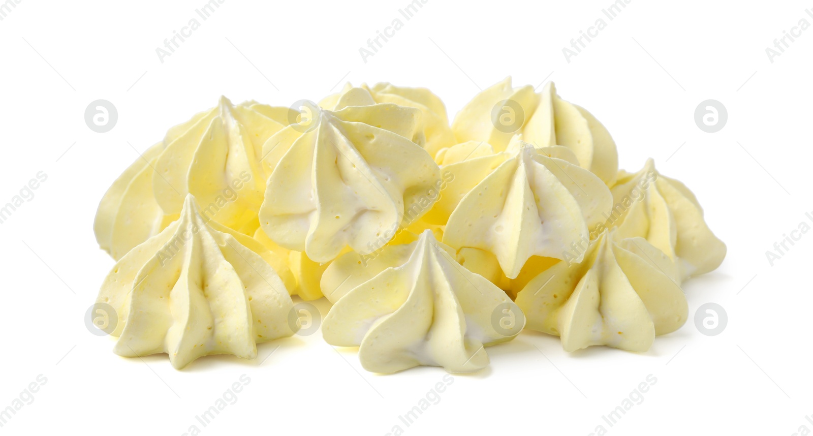 Photo of Many delicious meringue cookies isolated on white