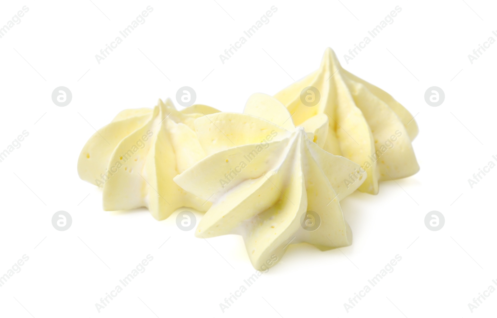 Photo of Three delicious meringue cookies isolated on white