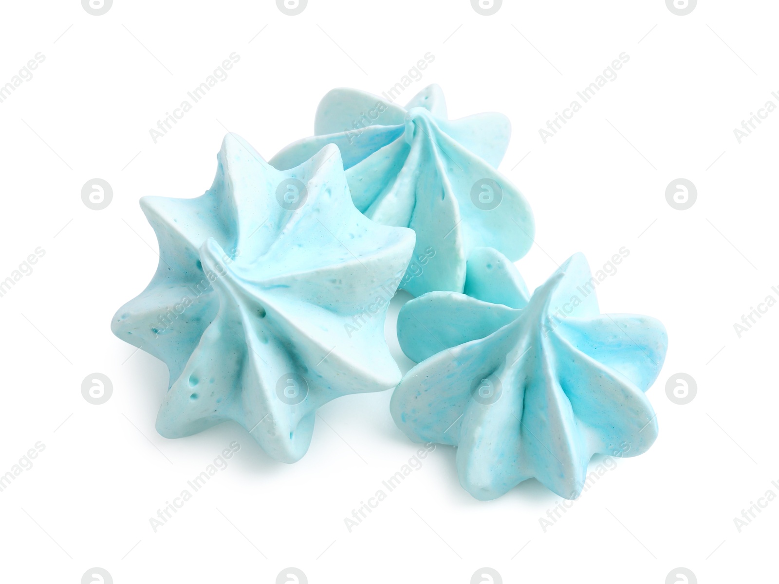 Photo of Three delicious meringue cookies isolated on white