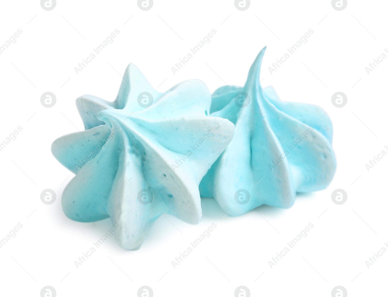 Photo of Two delicious meringue cookies isolated on white