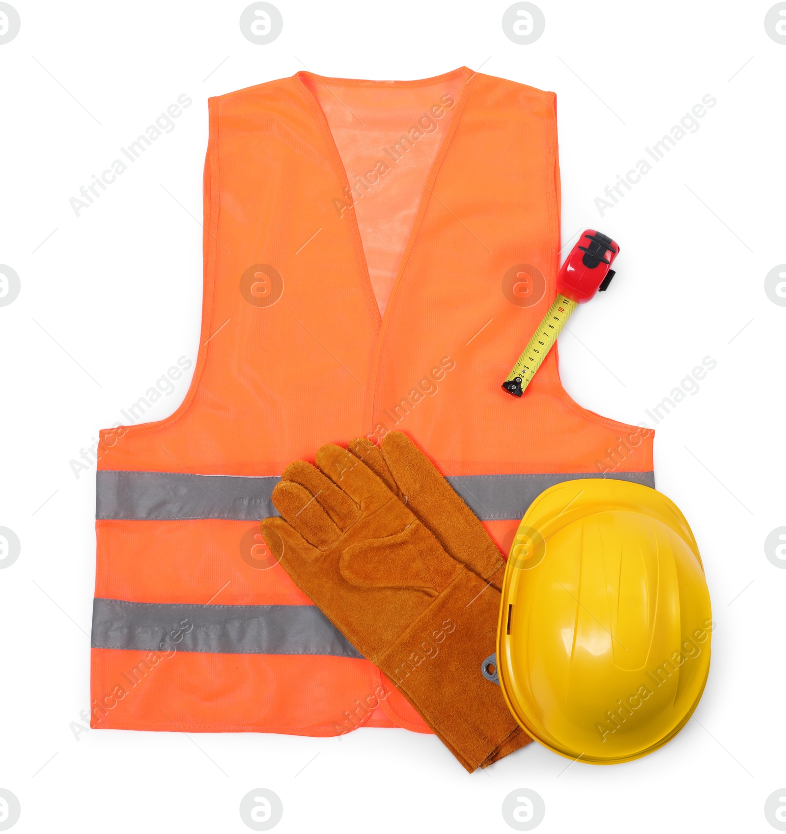 Photo of Orange reflective vest, hard hat, protective gloves and tape measure isolated on white, top view