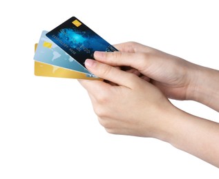 Woman holding credit cards on white background, closeup