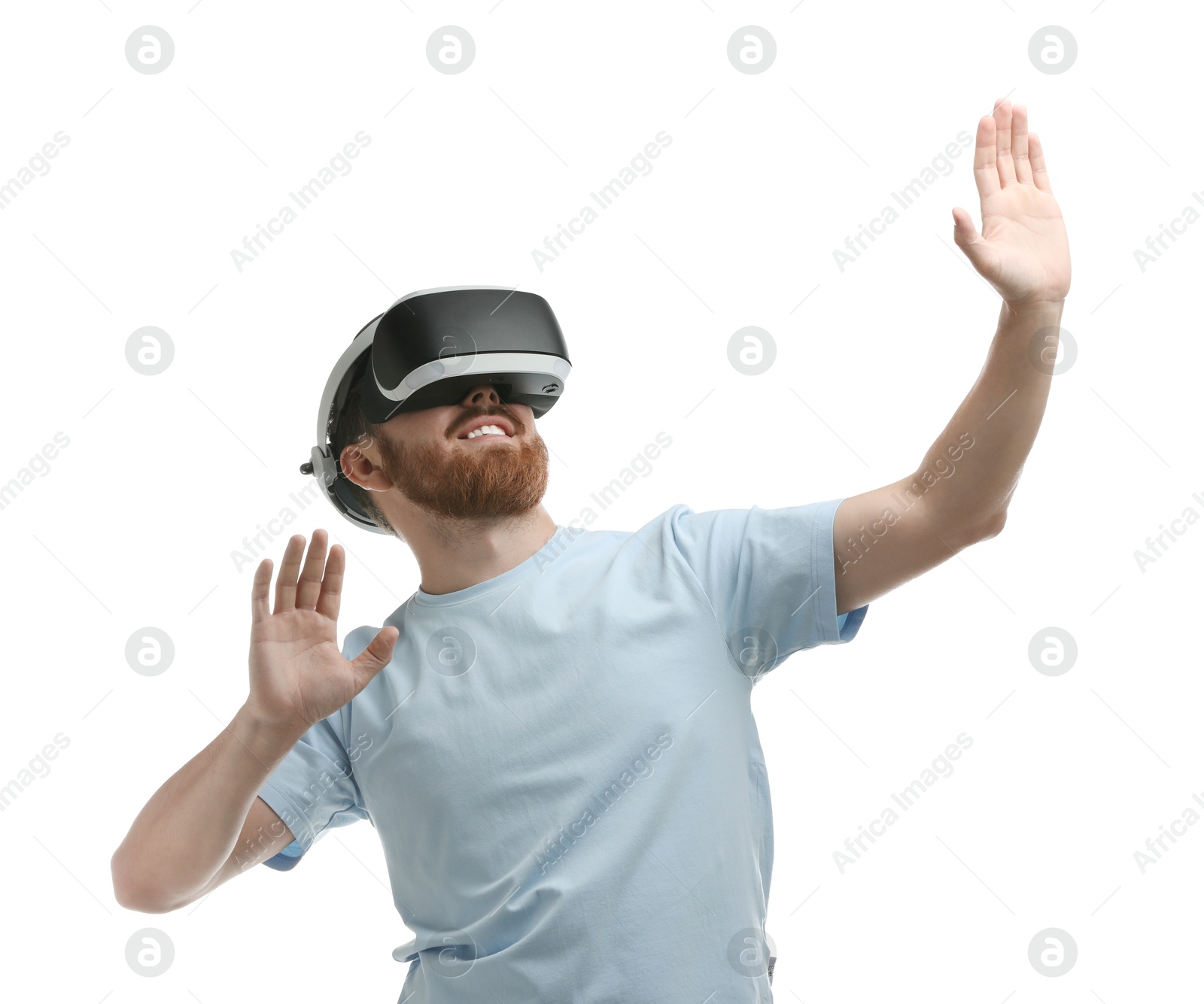 Photo of Smiling man using virtual reality headset on white background