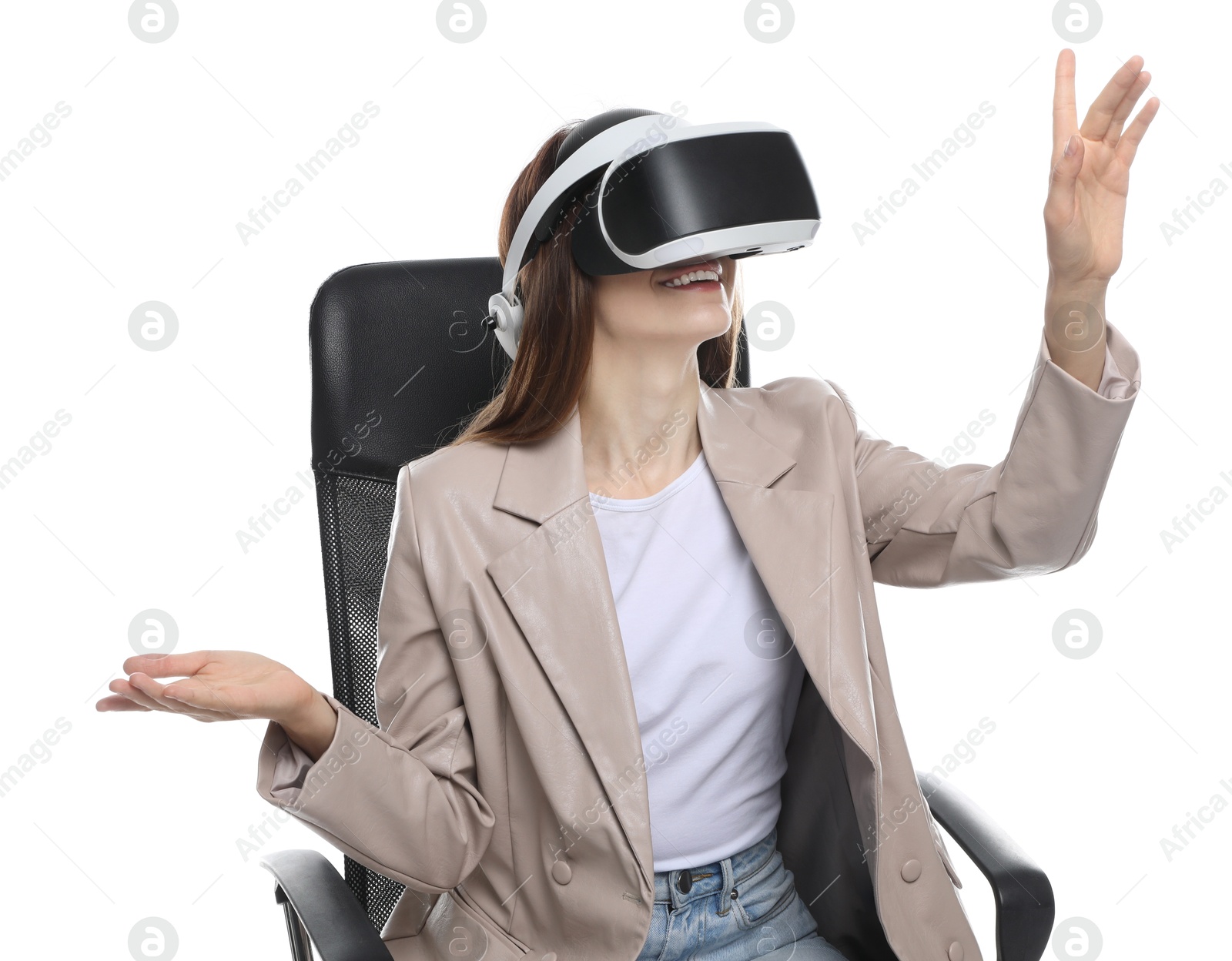 Photo of Smiling woman using virtual reality headset while sitting in office chair on white background