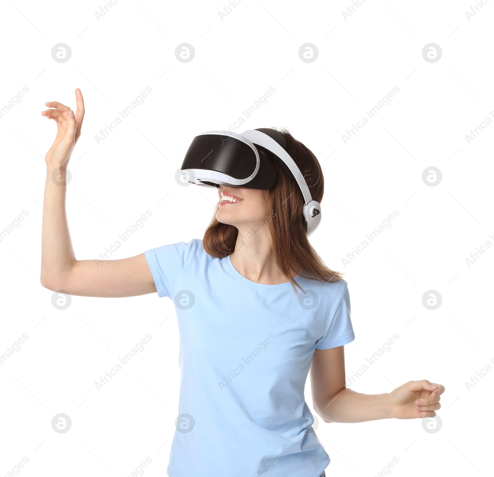 Photo of Smiling woman using virtual reality headset on white background