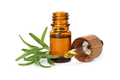 Photo of Aromatic essential oil in bottle, pipette and rosemary isolated on white