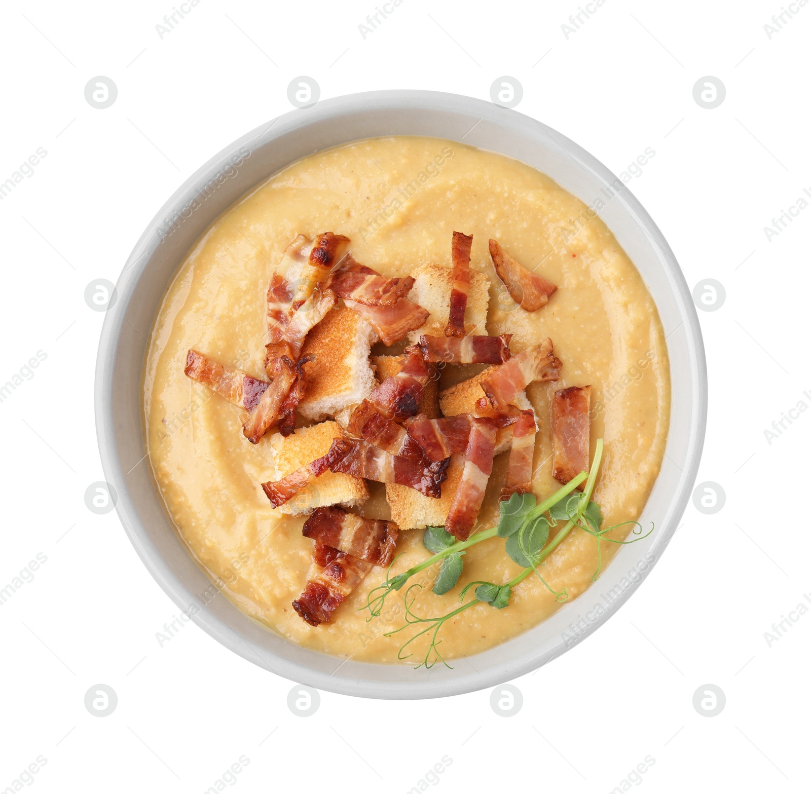 Photo of Delicious lentil soup with bacon and croutons isolated on white, top view