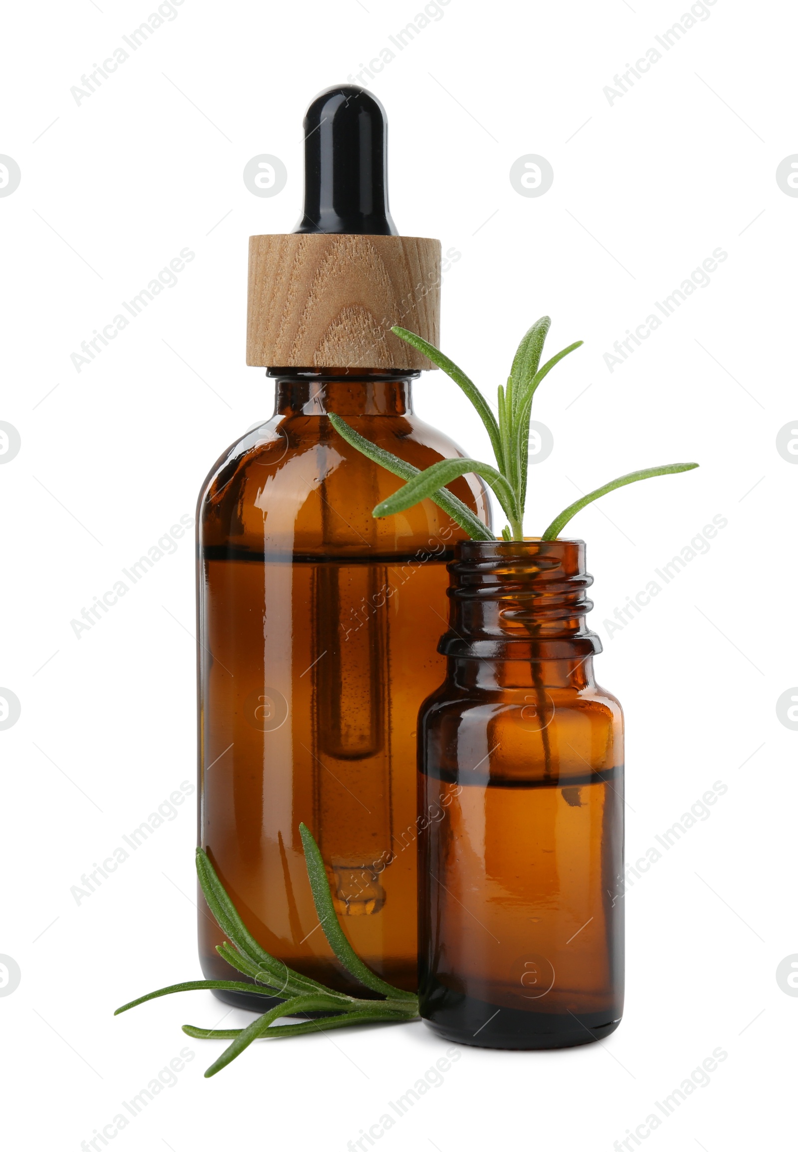 Photo of Bottles of essential oil and fresh rosemary isolated on white