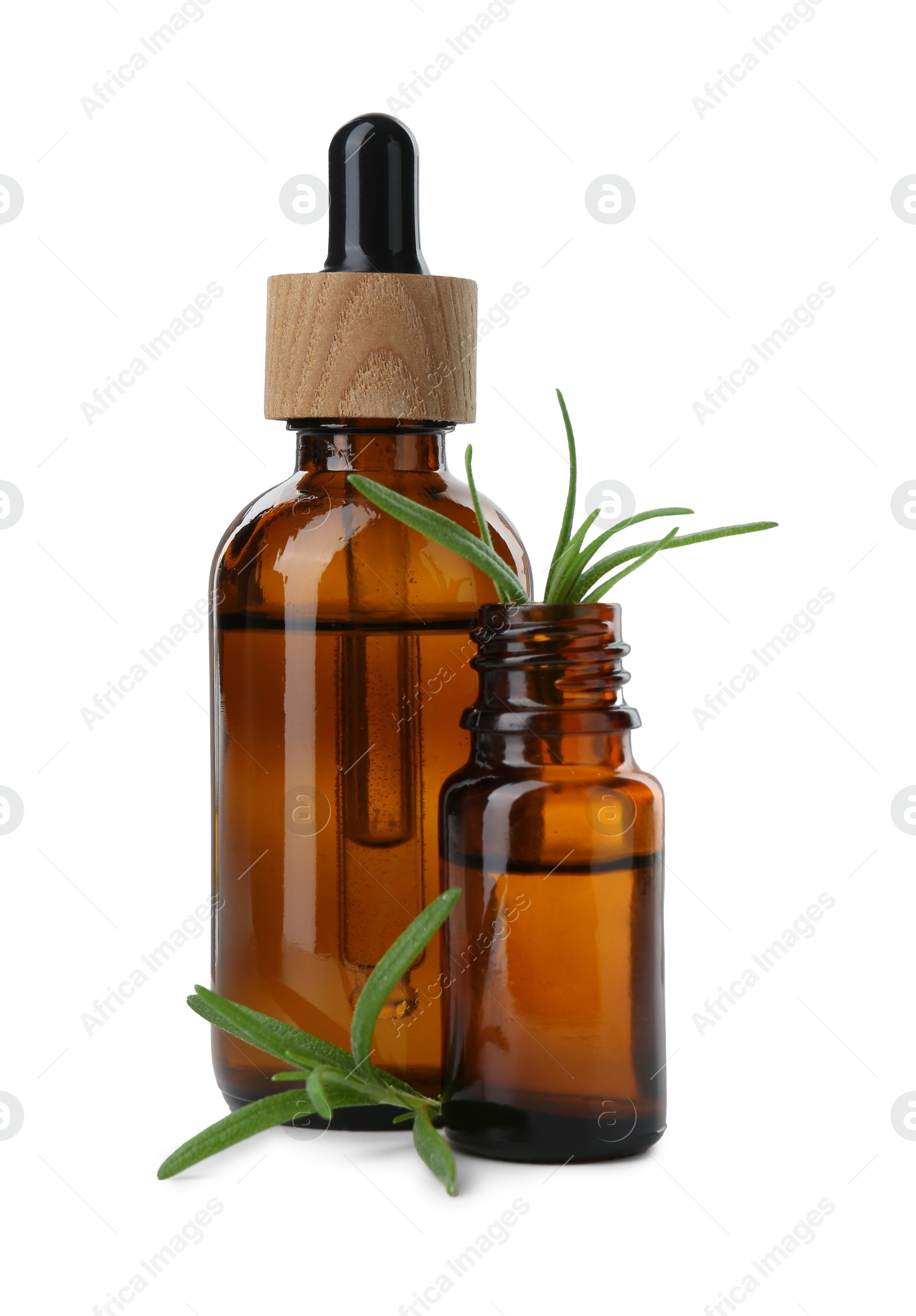 Photo of Bottles of essential oil and fresh rosemary isolated on white