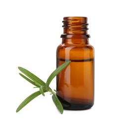 Bottle of essential oil and fresh rosemary isolated on white