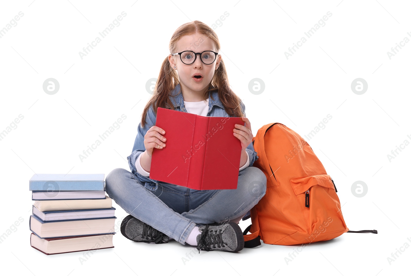 Photo of Cute little girl with stack of books and backpack on white background