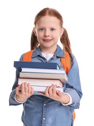 Smiling girl with stack of books on white background