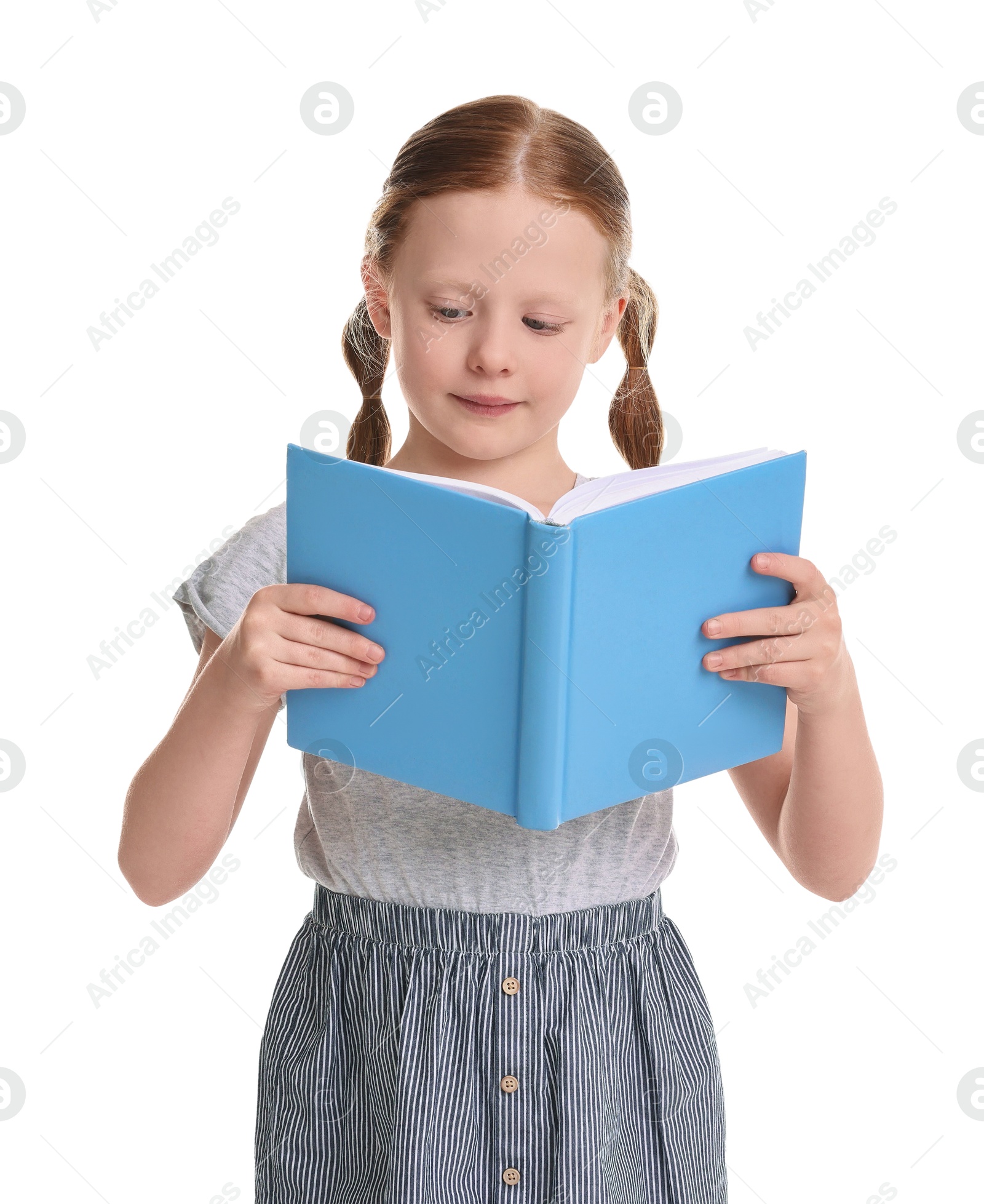 Photo of Cute little girl reading book on white background