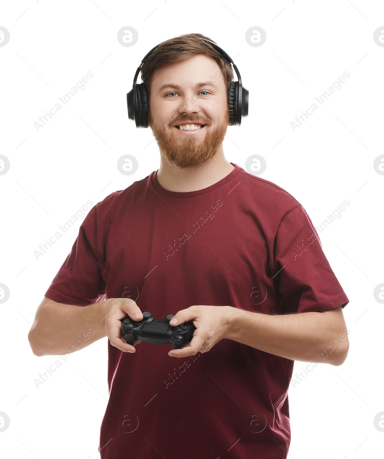 Photo of Happy man in headphones with game controller on white background