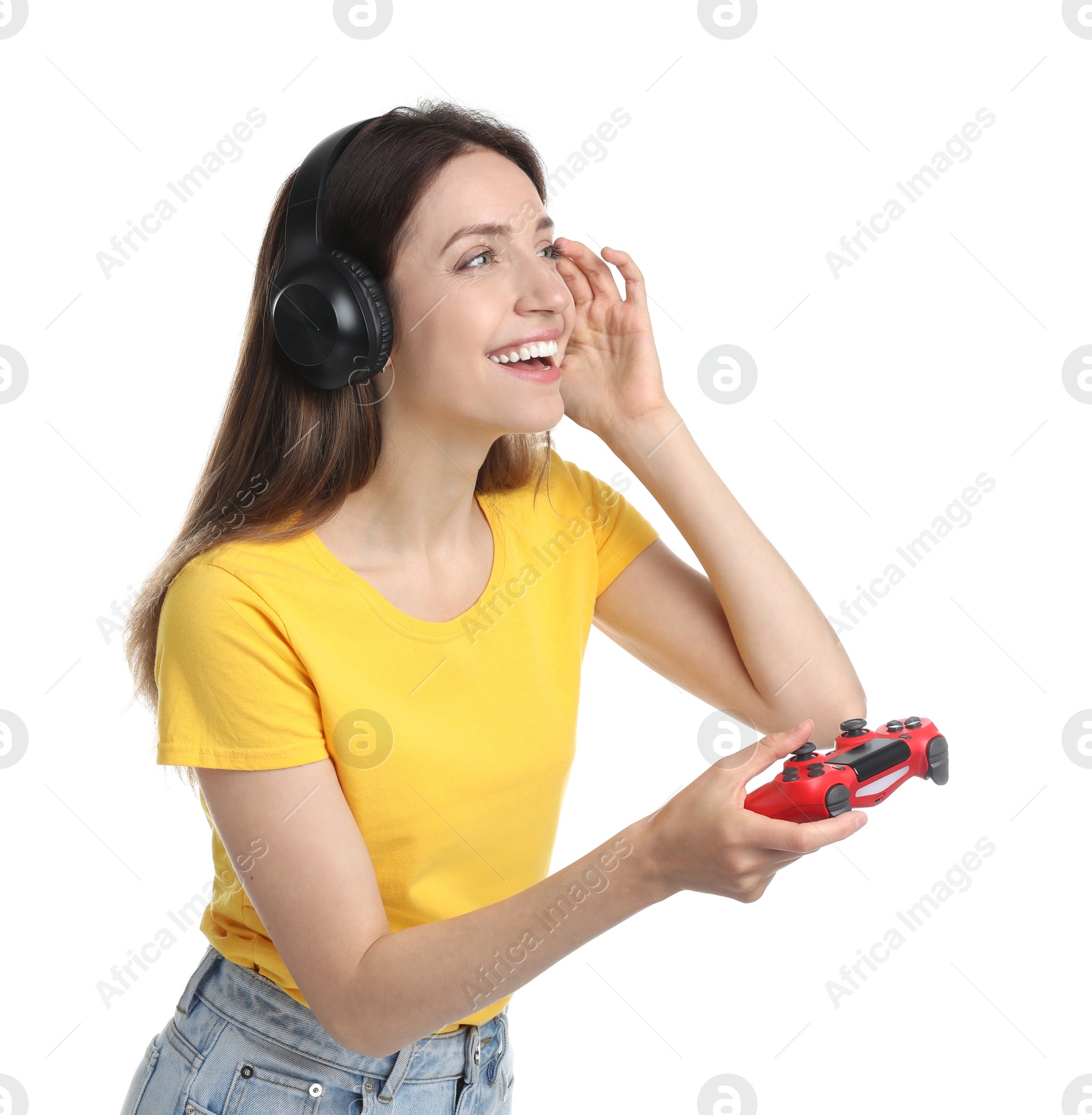 Photo of Happy woman in headphones playing video game with controller on white background