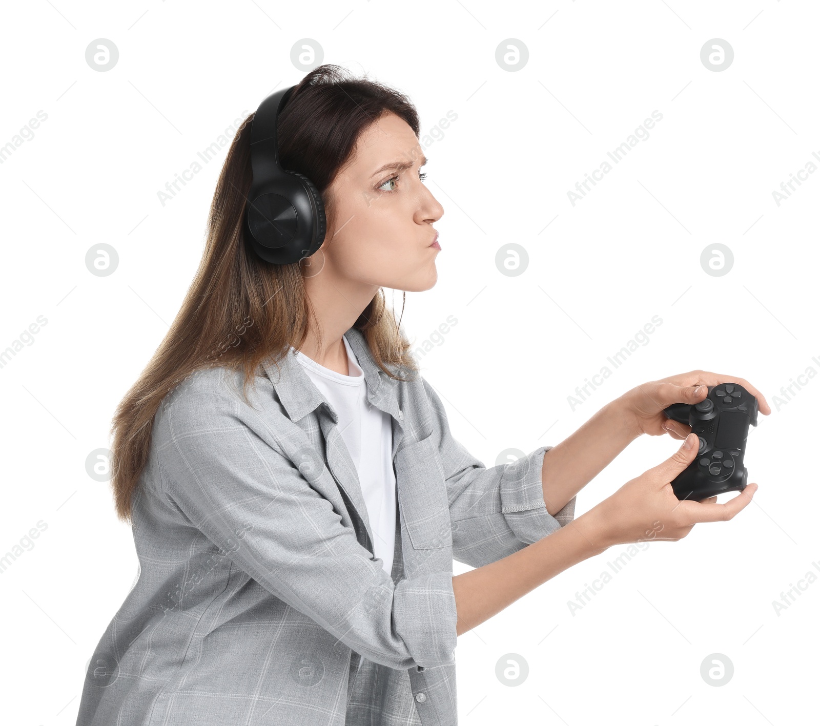 Photo of Woman in headphones playing video game with controller on white background