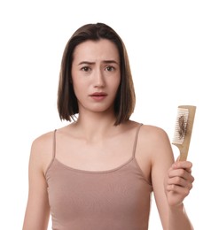 Photo of Stressed woman holding comb with lost hair on white background. Alopecia problem