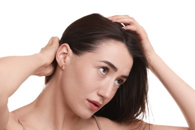 Photo of Young woman with hair loss problem on white background, closeup